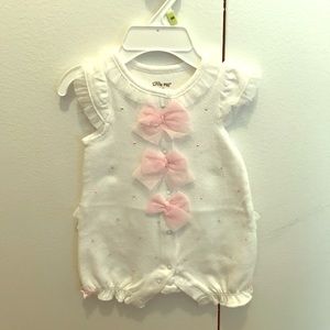 White onesie with pink bows and polka dots